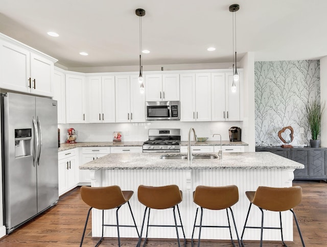 2734 Lakeland Dr, Nashville, TN 37214 - kitchen with appliances with stainless steel finishes, a sink, white cabinetry, and recessed lighting