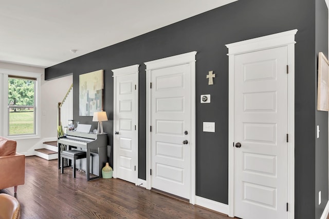 2734 Lakeland Dr, Nashville, TN 37214 - entryway with dark wood-style floors, stairs, and baseboards