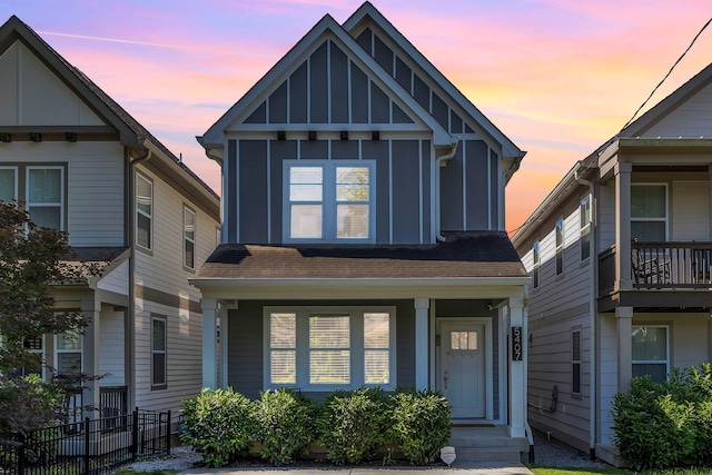 5407 Tennessee Ave, Nashville, TN 37209 - view of front facade featuring board and batten siding, a shingled roof, and covered porch