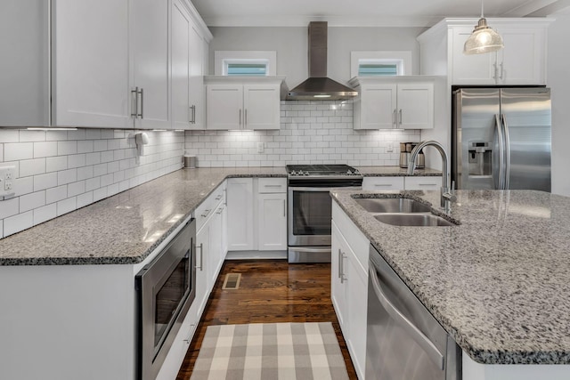 5407 Tennessee Ave, Nashville, TN 37209 - kitchen featuring appliances with stainless steel finishes, wall chimney range hood, a sink, and white cabinets