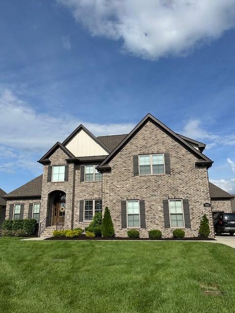2713 Carousel Dr, Murfreesboro, TN 37128 - view of front of home with brick siding and a front lawn