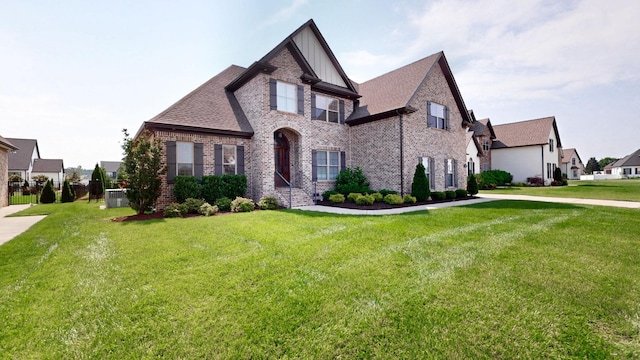 2713 Carousel Dr, Murfreesboro, TN 37128 - view of front of home with brick siding, a front lawn, board and batten siding, and a residential view