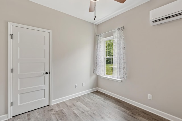 114 Eno Rd, Dickson, TN 37055 - empty room featuring a wall mounted AC, wood finished floors, and a ceiling fan