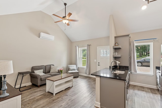 114 Eno Rd, Dickson, TN 37055 - living area with an AC wall unit, ceiling fan, light wood finished floors, and high vaulted ceiling