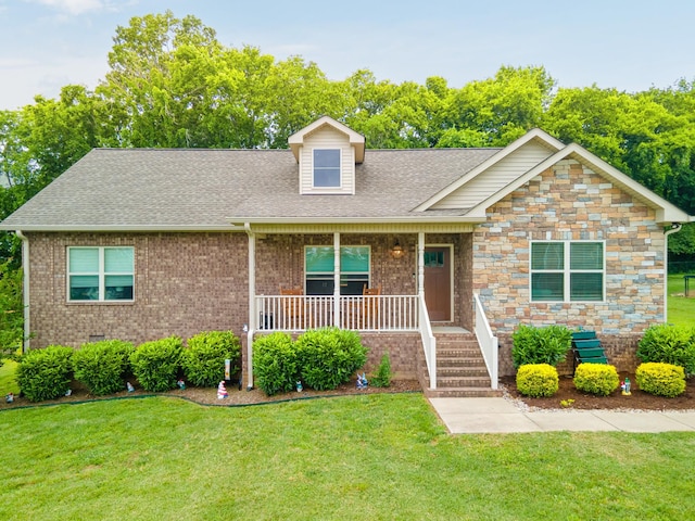 105 Mockingbird Ln, Hartsville, TN 37074 - view of front facade featuring a porch, a shingled roof, a front lawn, and crawl space