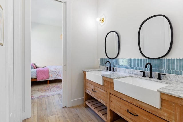 1222 Rock Church Rd, Dickson, TN 37055 - bathroom with double vanity, wood finished floors, ensuite bathroom, and baseboards