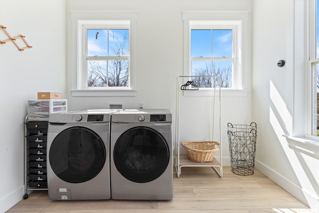 1222 Rock Church Rd, Dickson, TN 37055 - laundry room with separate washer and dryer, wood finished floors, and baseboards