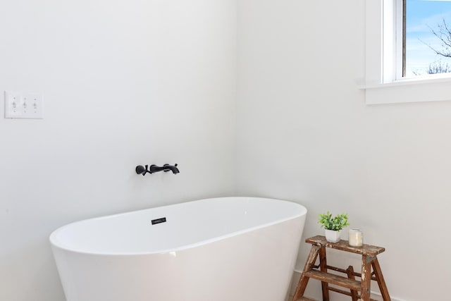 1222 Rock Church Rd, Dickson, TN 37055 - full bath featuring a freestanding tub and baseboards