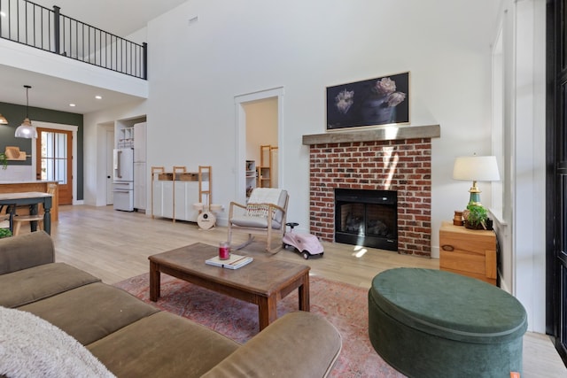 1222 Rock Church Rd, Dickson, TN 37055 - living room with wood finished floors, a brick fireplace, and a high ceiling
