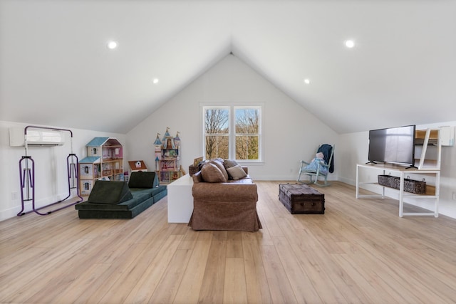 1222 Rock Church Rd, Dickson, TN 37055 - living room with wood finished floors, a wall mounted AC, lofted ceiling, and baseboards