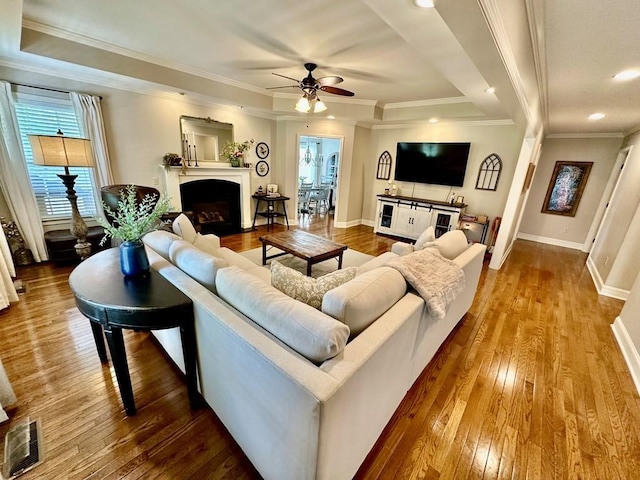 593 Imperial Dr, Sparta, TN 38583 - living area with dark wood-type flooring, ceiling fan, a fireplace with flush hearth, recessed lighting, and baseboards