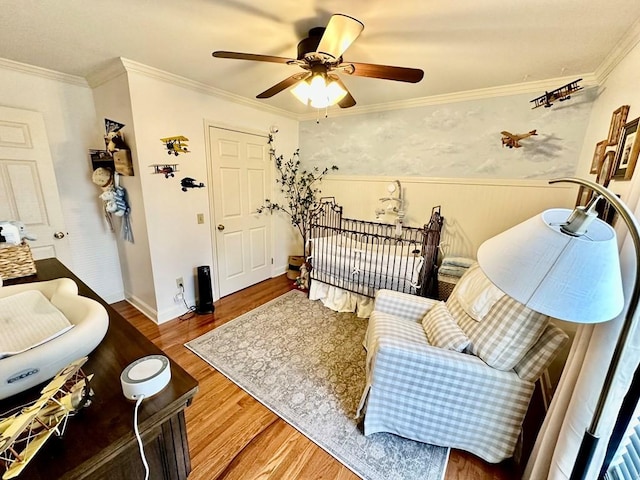 593 Imperial Dr, Sparta, TN 38583 - living area featuring wood finished floors, a ceiling fan, wainscoting, and crown molding