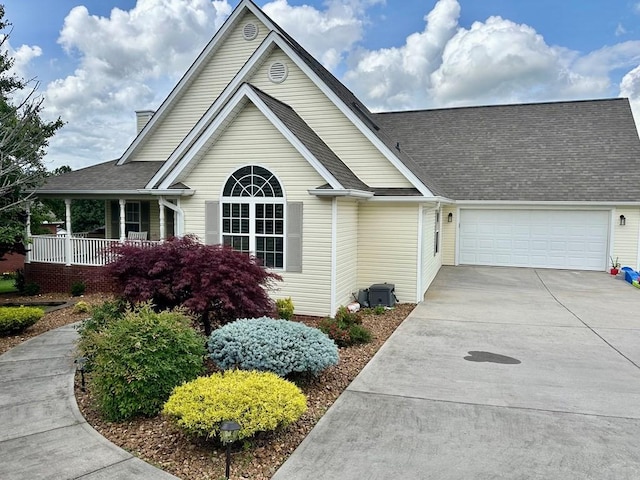 593 Imperial Dr, Sparta, TN 38583 - view of front of property with a garage, driveway, a shingled roof, and covered porch