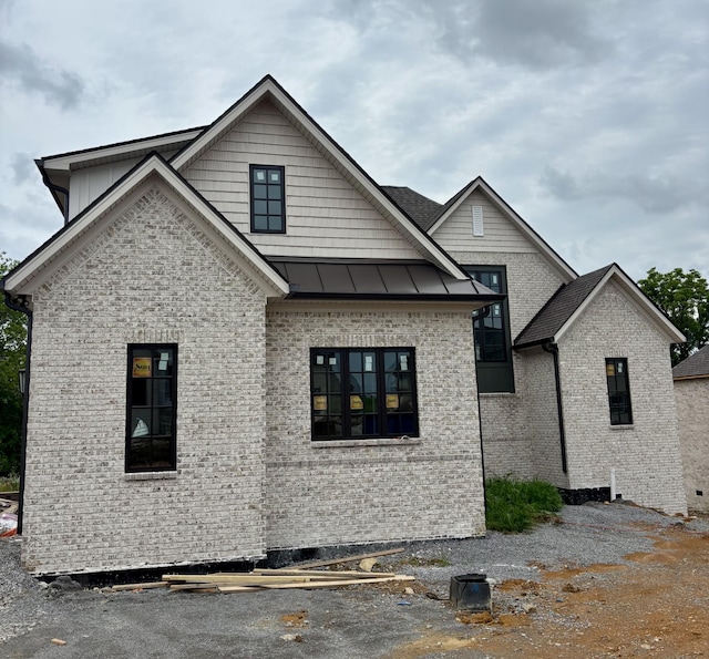 306 Oaks Xing, Lebanon, TN 37087 - view of front of home featuring brick siding and a standing seam roof