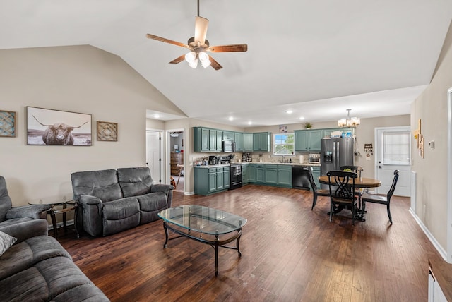1310 Ray Broyles Rd, Sparta, TN 38583 - living room featuring a ceiling fan, dark wood-style floors, vaulted ceiling, a chandelier, and recessed lighting