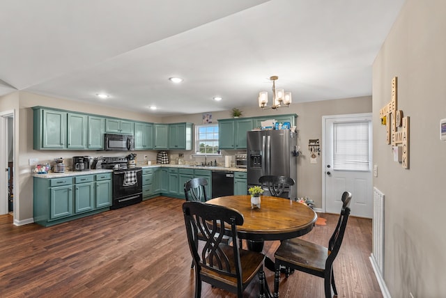1310 Ray Broyles Rd, Sparta, TN 38583 - dining area with a chandelier, dark wood finished floors, baseboards, and recessed lighting