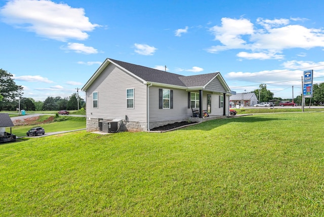 1310 Ray Broyles Rd, Sparta, TN 38583 - back of house featuring a lawn and central AC