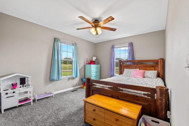 1310 Ray Broyles Rd, Sparta, TN 38583 - carpeted bedroom with multiple windows, baseboards, and a ceiling fan