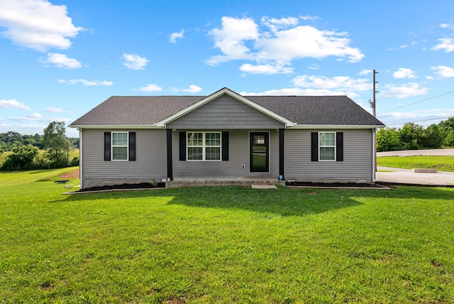 1310 Ray Broyles Rd, Sparta, TN 38583 - single story home featuring a front yard, a porch, and a shingled roof