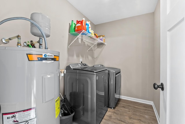 1310 Ray Broyles Rd, Sparta, TN 38583 - washroom featuring water heater, washer and dryer, wood finished floors, and baseboards