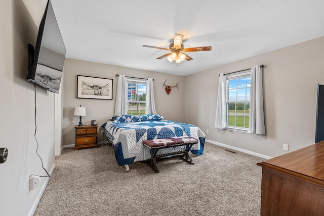 1310 Ray Broyles Rd, Sparta, TN 38583 - bedroom featuring multiple windows, baseboards, carpet flooring, and a ceiling fan