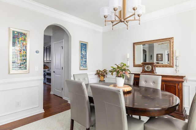 6050 Huntmere Ave, Franklin, TN 37064 - dining room with arched walkways, dark wood-style flooring, a chandelier, crown molding, and a wainscoted wall