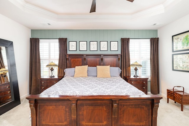 6050 Huntmere Ave, Franklin, TN 37064 - bedroom featuring a tray ceiling, light carpet, crown molding, multiple windows, and baseboards