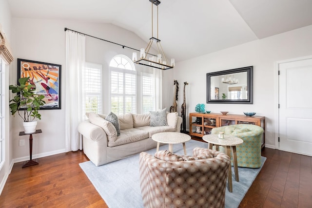 6050 Huntmere Ave, Franklin, TN 37064 - living area with lofted ceiling, dark wood-style flooring, a chandelier, and baseboards
