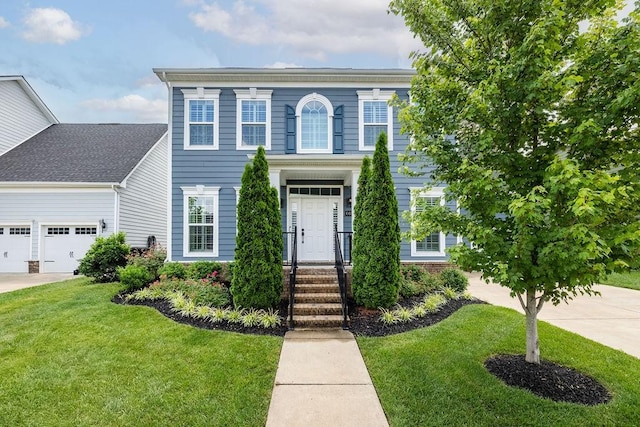 6050 Huntmere Ave, Franklin, TN 37064 - view of front of property with a front lawn, concrete driveway, and an attached garage