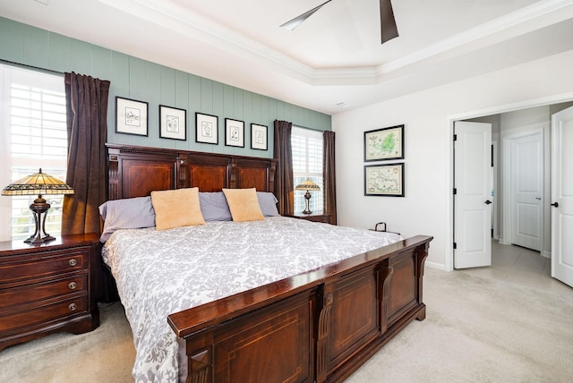 6050 Huntmere Ave, Franklin, TN 37064 - bedroom with light colored carpet, ornamental molding, a tray ceiling, and a ceiling fan