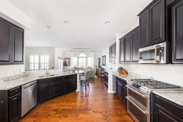6050 Huntmere Ave, Franklin, TN 37064 - kitchen featuring appliances with stainless steel finishes, dark wood-type flooring, a sink, plenty of natural light, and recessed lighting
