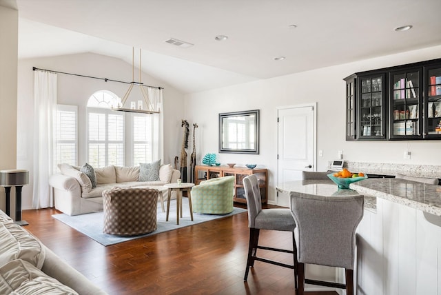6050 Huntmere Ave, Franklin, TN 37064 - living room featuring lofted ceiling, dark wood finished floors, a chandelier, and recessed lighting