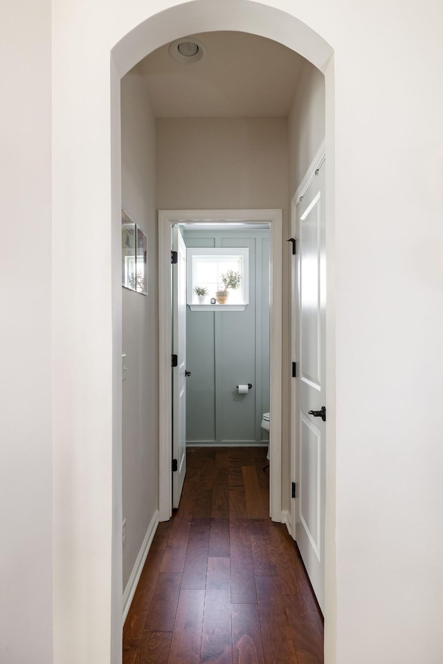 6050 Huntmere Ave, Franklin, TN 37064 - hallway with arched walkways, dark wood-type flooring, and baseboards