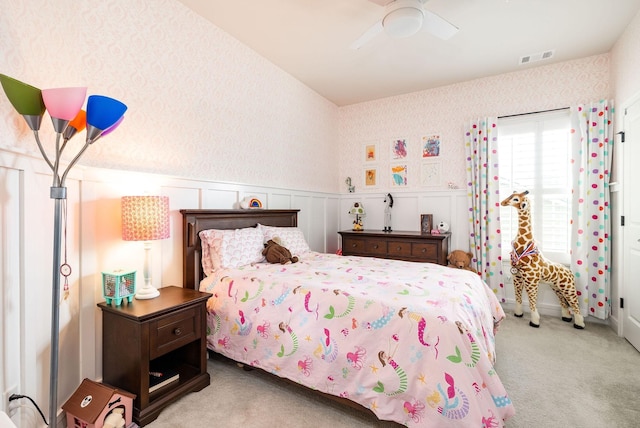 6050 Huntmere Ave, Franklin, TN 37064 - carpeted bedroom featuring wallpapered walls, a wainscoted wall, and ceiling fan