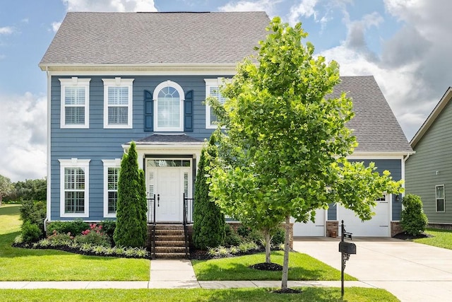6050 Huntmere Ave, Franklin, TN 37064 - view of front of home with driveway, a front lawn, and an attached garage
