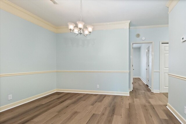 2101 Benton Hall Ct, Columbia, TN 38401 - spare room featuring crown molding, a chandelier, wood finished floors, and baseboards