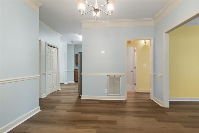 2101 Benton Hall Ct, Columbia, TN 38401 - unfurnished dining area with crown molding, a chandelier, wood finished floors, and baseboards