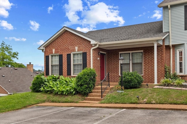 2101 Benton Hall Ct, Columbia, TN 38401 - view of front of home featuring brick siding, uncovered parking, and roof with shingles
