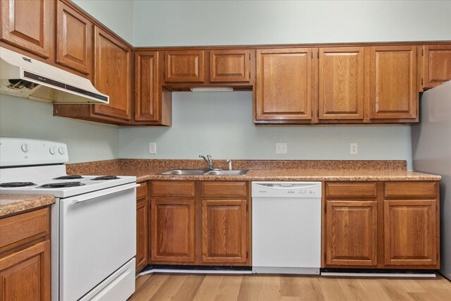 2101 Benton Hall Ct, Columbia, TN 38401 - kitchen featuring white appliances, under cabinet range hood, a sink, brown cabinetry, and light wood finished floors