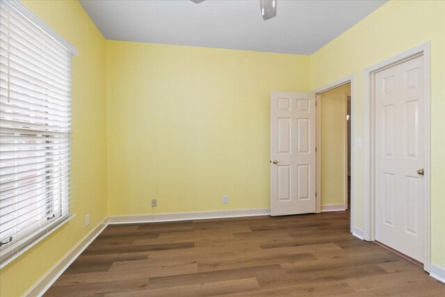 2101 Benton Hall Ct, Columbia, TN 38401 - unfurnished bedroom featuring multiple windows, wood finished floors, and baseboards