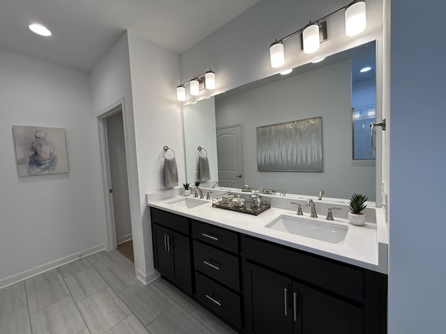 6705 Major Hutchings Dr, Hermitage, TN 37076 - bathroom with double vanity, tile patterned flooring, baseboards, and recessed lighting