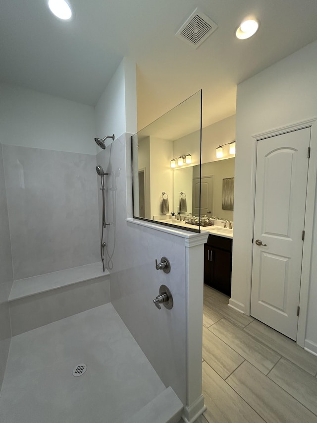 6705 Major Hutchings Dr, Hermitage, TN 37076 - bathroom featuring tiled shower, vanity, and recessed lighting