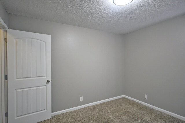 545 Donna Dr, Clarksville, TN 37042 - carpeted empty room with a textured ceiling and baseboards