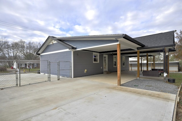 545 Donna Dr, Clarksville, TN 37042 - view of property exterior featuring a gate, a carport, driveway, and a shingled roof