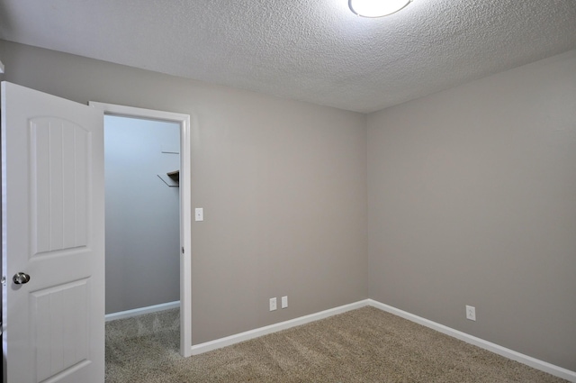 545 Donna Dr, Clarksville, TN 37042 - empty room featuring carpet floors, a textured ceiling, and baseboards