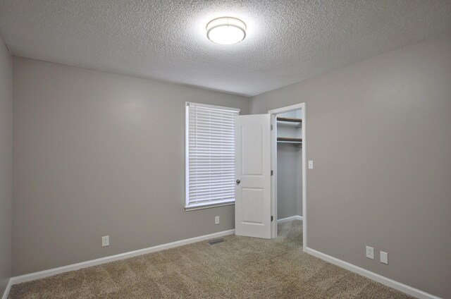 545 Donna Dr, Clarksville, TN 37042 - empty room featuring carpet, a textured ceiling, and baseboards