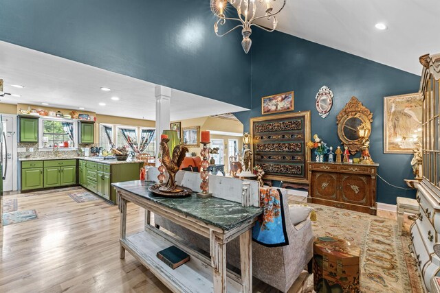 1313 Stayton Rd, Cumberland Furnace, TN 37051 - dining area featuring light wood finished floors, ornate columns, recessed lighting, a chandelier, and high vaulted ceiling