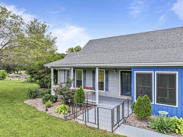 1313 Stayton Rd, Cumberland Furnace, TN 37051 - view of front of house featuring a porch, a front lawn, and a shingled roof