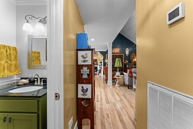 1313 Stayton Rd, Cumberland Furnace, TN 37051 - hall with a sink, light wood-style flooring, and crown molding