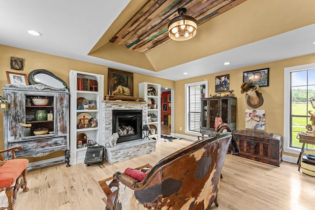 1313 Stayton Rd, Cumberland Furnace, TN 37051 - living area featuring wood finished floors, a stone fireplace, recessed lighting, baseboards, and vaulted ceiling
